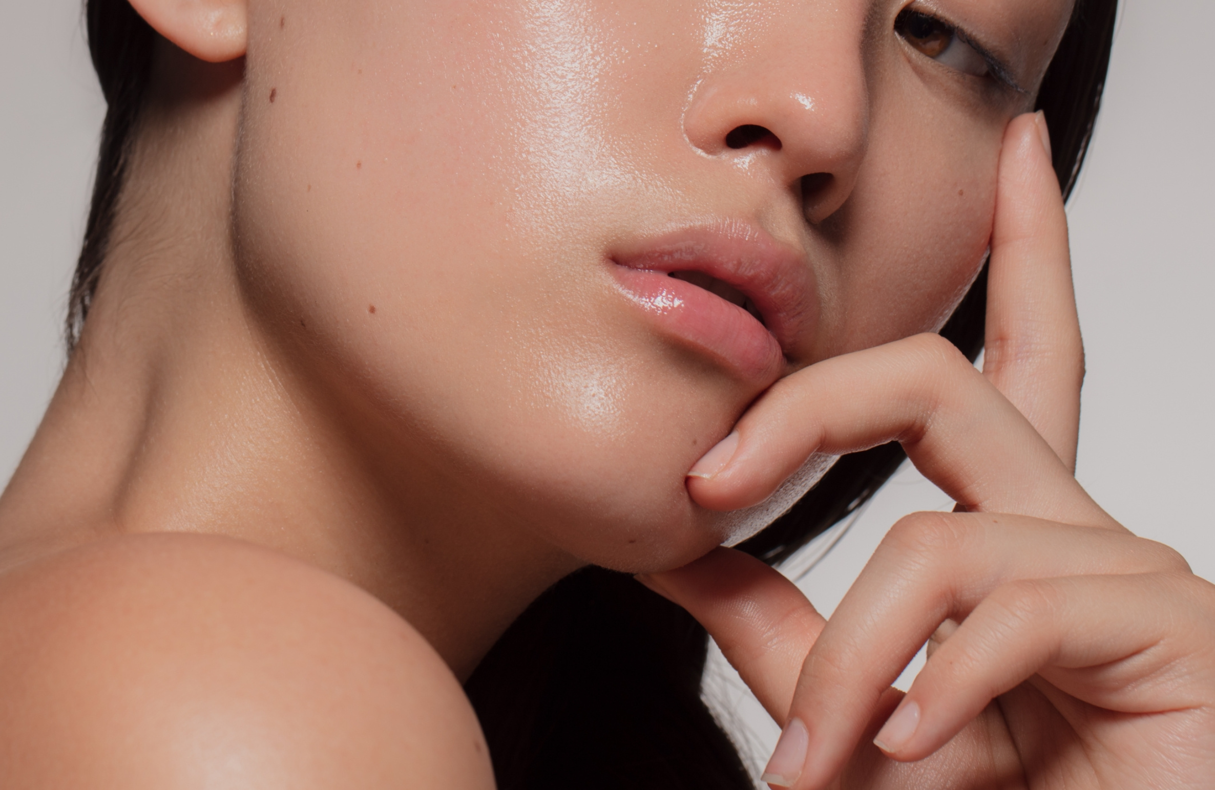 Close-up of a woman’s radiant, smooth, and glowing skin — The Secret Behind Celebrity Glass Skin – And How You Can Get It.