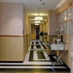 Elegant hallway interior with modern décor and certificate displays at the Best Skin Clinic in Kondapur.