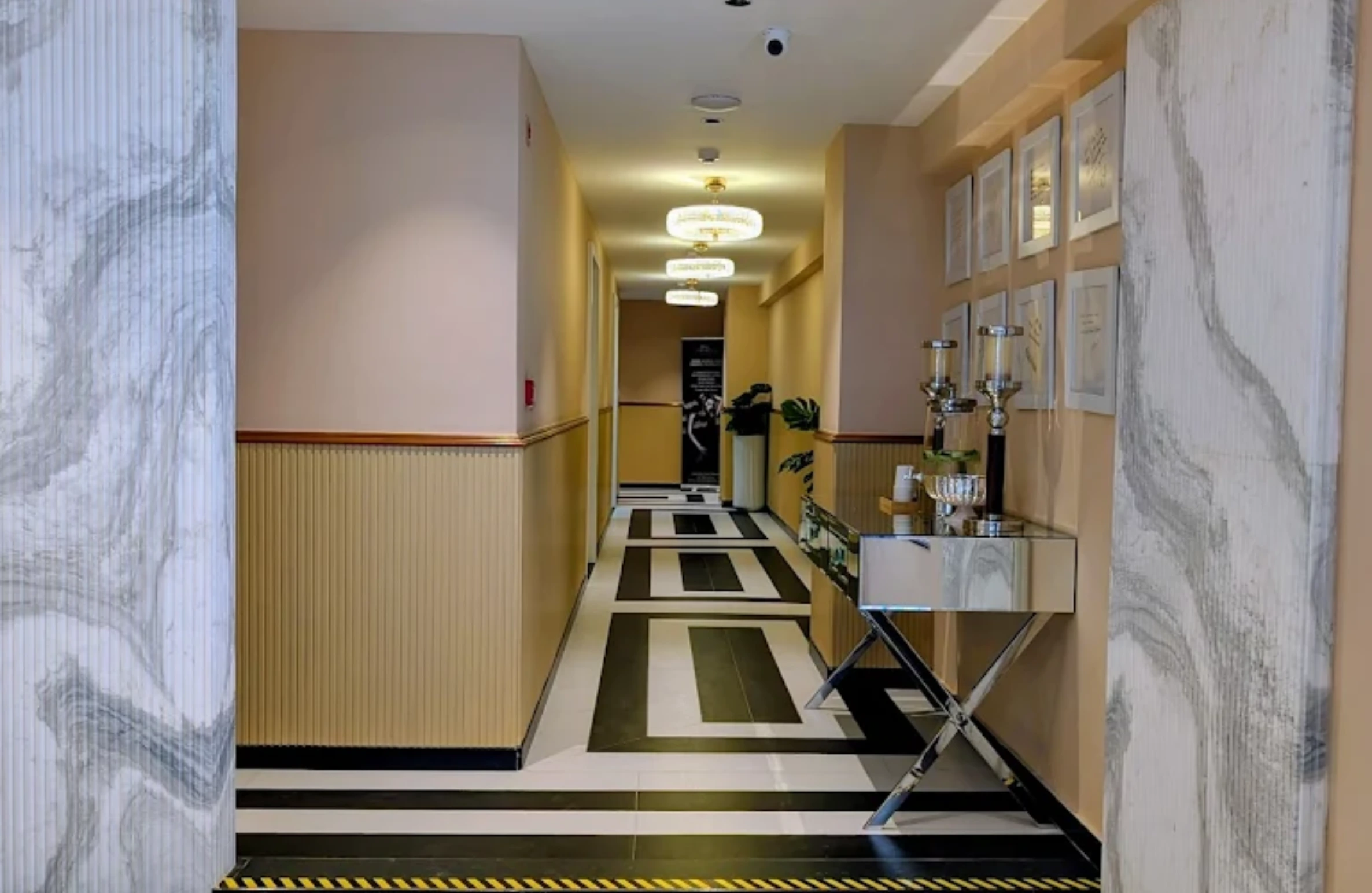 Elegant hallway interior with modern décor and certificate displays at the Best Skin Clinic in Kondapur.